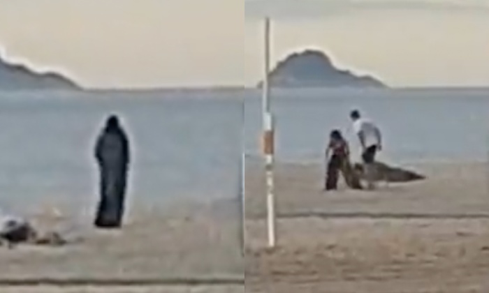 Casal que fazia ‘lepo lepo’ na praia é interrompido pela ‘m0rte’ que queria ser voyeur; veja vídeo