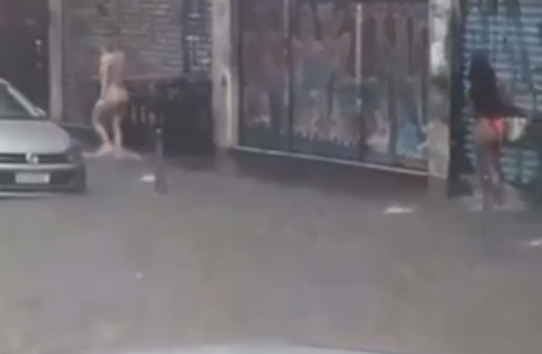 Mulheres são flagradas saindo de hotel pelad0nas durante temporal no Centro; veja video