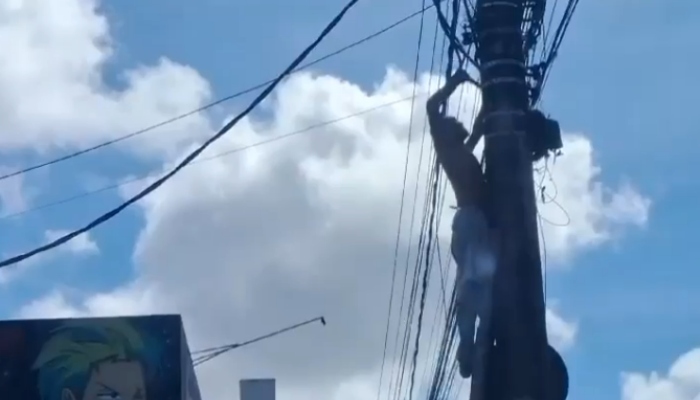 Insano: homem desafia a m0rte para furtar fios elétricos no Tancredo Neves; veja vídeo